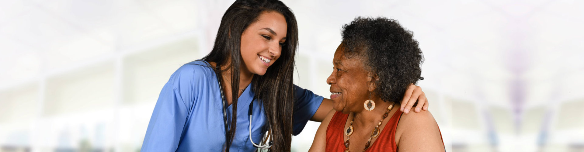 a female nurse smiling with a patient